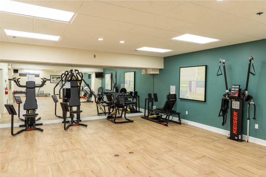 Bright, welcoming common area where residents receive discreet senior personal care support for rehabilitation 
